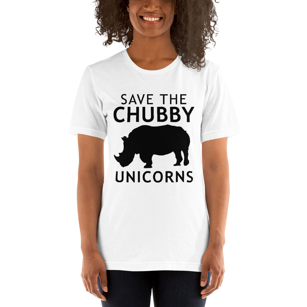 A young black woman wears a T-shirt with an image of a silhouetted rhino that says "Save the Chubby Unicorns."